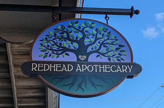redhead apothecary sign