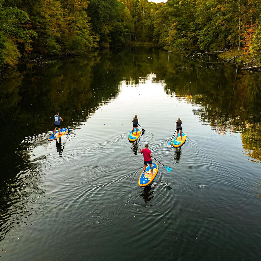 simplyfitness1-Instagram-3715-ig-17993870735350877-900x900 Standing paddlers on water surrounded by trees.