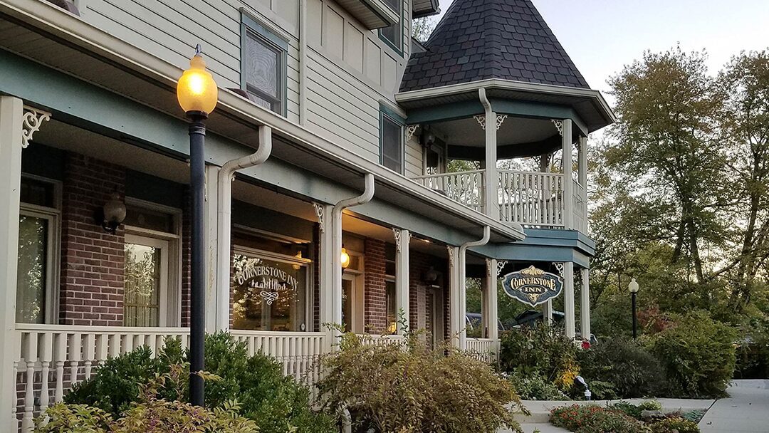 A glassblower working with torch