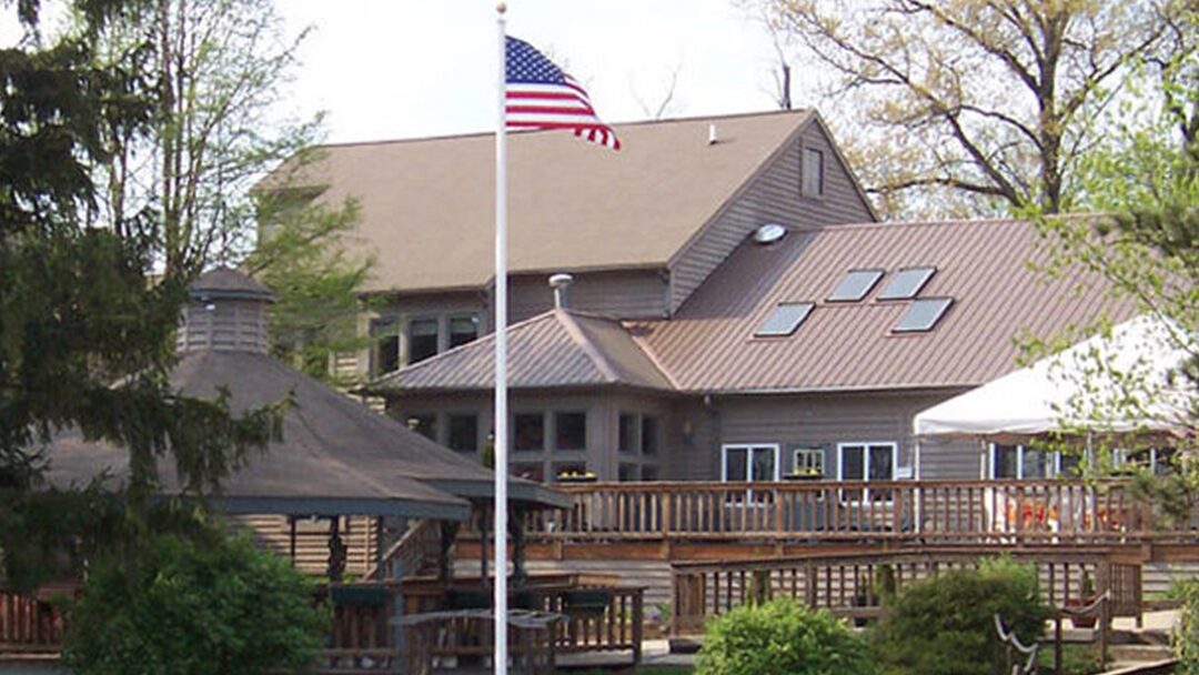 A glassblower working with torch