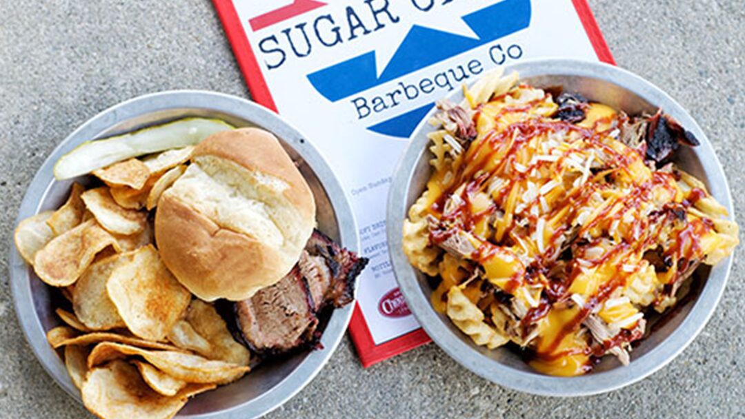 A glassblower working with torch